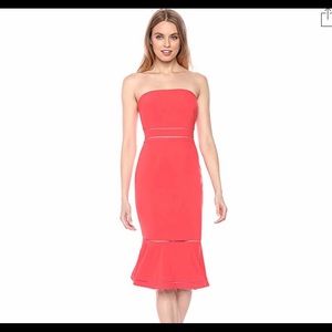 Likely "Abbott" cocktail dress with cutout trim.